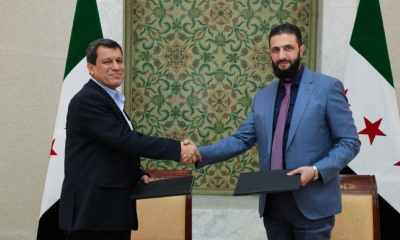 A comprehensive agreement between the Syrian government and the SDF to unify the country